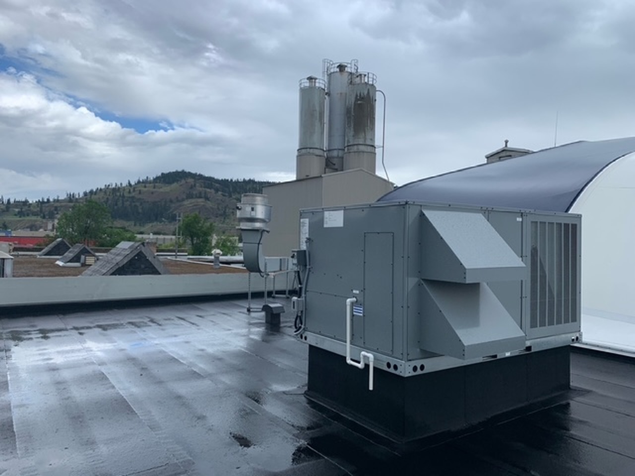 Commercial rooftop HVAC unit overlooking the Okanagan valley