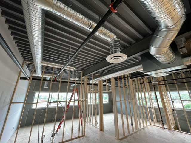 Commercial ductwork and air distribution installed inside a building under construction