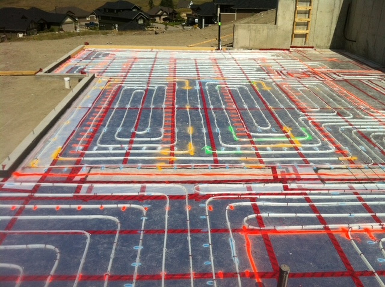 In-floor radiant heating tubing laid across a slab at an Okanagan construction site