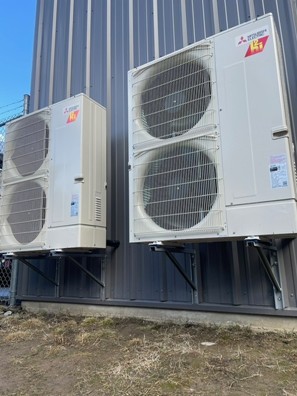 Mitsubishi heat pump condensers installed on an Okanagan building